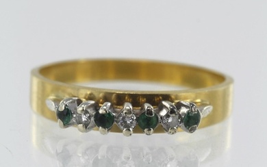 Yellow gold (tests 18ct) diamond and emerald ring, three dia...
