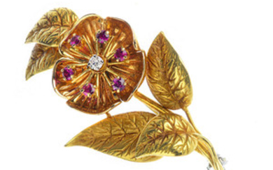 A 1960s 18ct gold diamond and ruby floral brooch. View more details