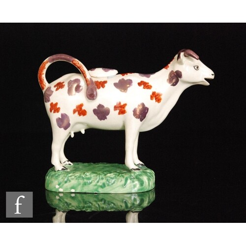 A 19th Century Welsh cow creamer and cover, possibly Cambria...