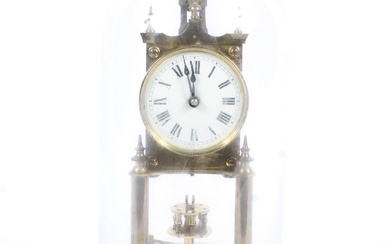 A 20th century Gustav Becker brass Anniversary torsion clock under a glass dome. With white enamelled dial and black Roman numerals, the movement stamped GB with crown and anchor, numbered 2450900, on a stepped base, the clock 22.5cm high, 27cm high...