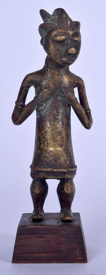 A BENIN BRONZE FIGURE OF A STANDING FEMALE, formed