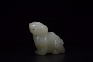 A CARVED WHITE JADE BEAST.QING PERIOD