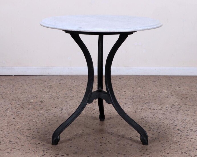 A CAST IRON AND MARBLE TOP BISTRO TABLE