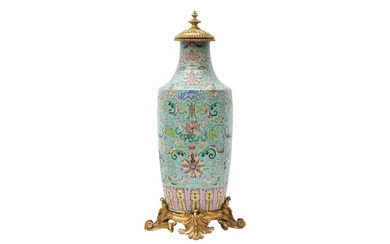 A CHINESE GILT-MOUNTED FAMILLE-ROSE TURQUOISE-GROUND 'LOTUS' VASE 清十九世紀 粉彩綠松石地蓮紋嵌鎏金銅飾瓶