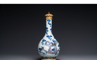 A Chinese blue, white and copper-red 'dragon' vase with gilt...