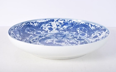 A Chinese porcelain blue and white Dragon dish 33 x 6 cm .