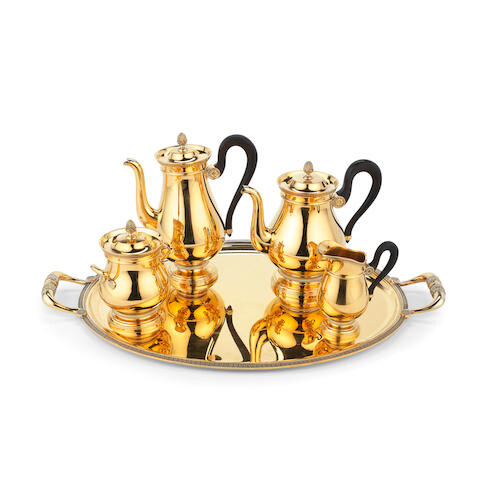 A French silver-gilt four-piece tea and coffee service with a matched gilt electroplated tray