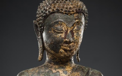 A GILT BRONZE FIGURE OF BUDDHA SHAKYAMUNI, LAOS, 16TH-17TH CENTURY