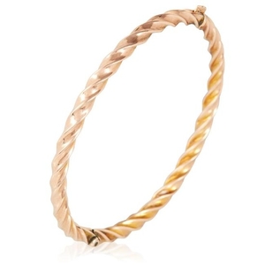 A GOLD BANGLE in yellow gold, in twisted gold motif