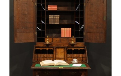 A George III oak estate office enclosed bureau bookcase, mou...