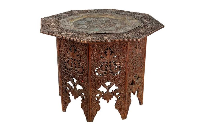 A KASHMIRI CARVED HARDWOOD FOLDABLE OCCASIONAL TABLE Kashmir, Northern India, late 19th century