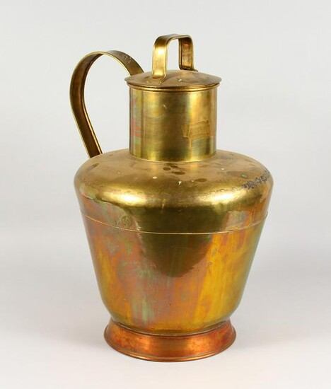 A LARGE BRASS AND COPPER CHURN, with strap handle and