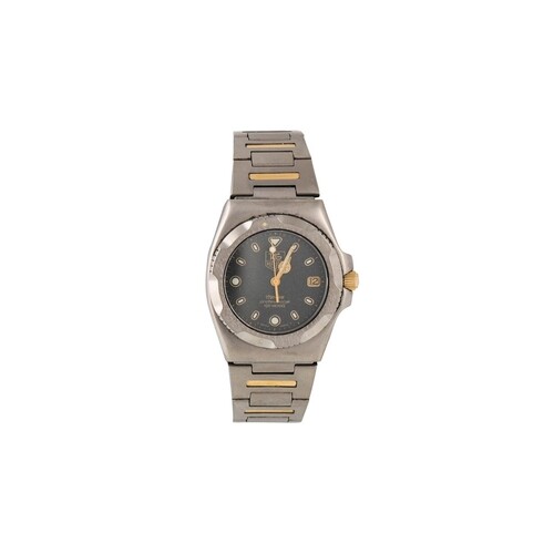 A LIMITED EDITION TITANIUM AND GOLD TAG HEUER WRIST WATCH, b...