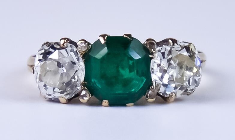 A Late 19th/Early 20th Century Three Stone Emerald and...