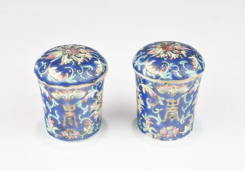 A PAIR OF CHINESE QING DYNAST FAMILLE ROSE SCROLL ENDS