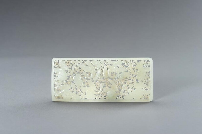 A RETICULATED YUAN STYLE PALE CELADON JADE PLAQUE