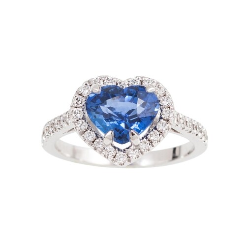 A SAPPHIRE AND DIAMOND CLUSTER RING, the heart shaped sapphi...