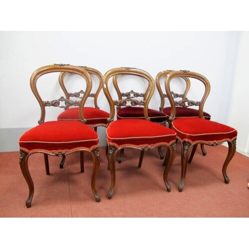 A Set of Six Mid XIX Century Walnut Salon Chairs, with a cen...