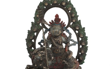 A Sino-Tibetan partly painted metal alloy figure of the two armed Jambhala...