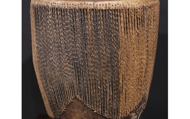 A Ugandan embuutu drum, hide bound hard wood, twin suspensio...