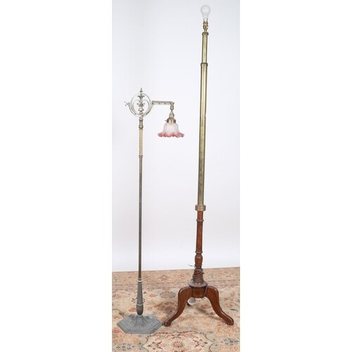 A VICTORIAN BRASS FLOOR STANDING LAMP the cylindrical and re...