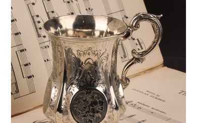 A Victorian silver mug, fluted and engraved with roses and s...