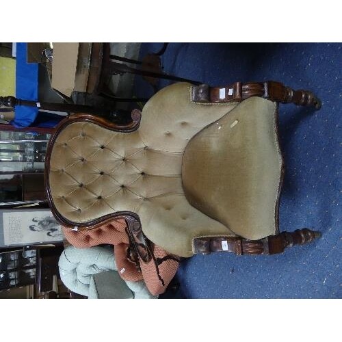 A Victorian walnut upholstered Armchair, the spoon back with...