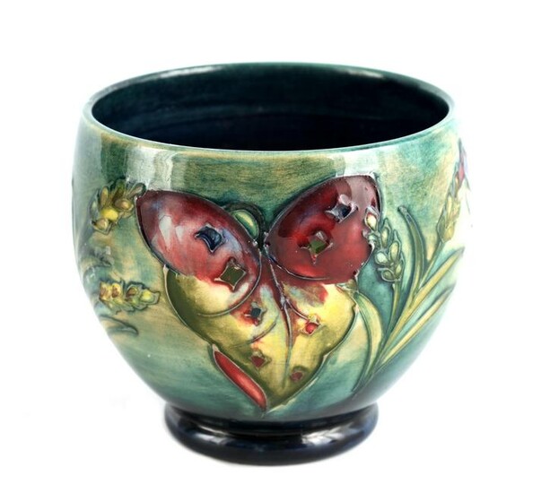 A WALTER MOORCROFT SQUAT FOOTED VASE tube lined an