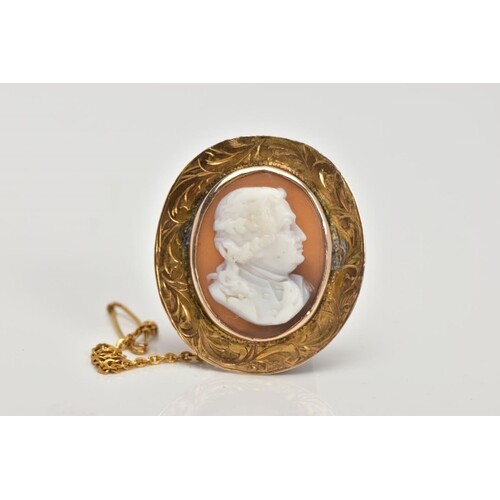 A YELLOW METAL CAMEO BROOCH, of an oval form, the carved she...