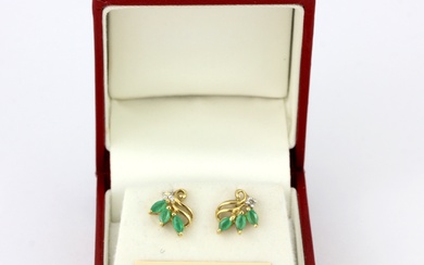 A boxed pair of 9ct yellow gold stud earrings set with marquise cut emeralds and diamonds, L. 1cm.