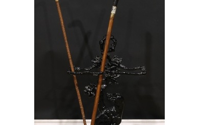A cast iron walking stick or umbrella stand, cast in the man...