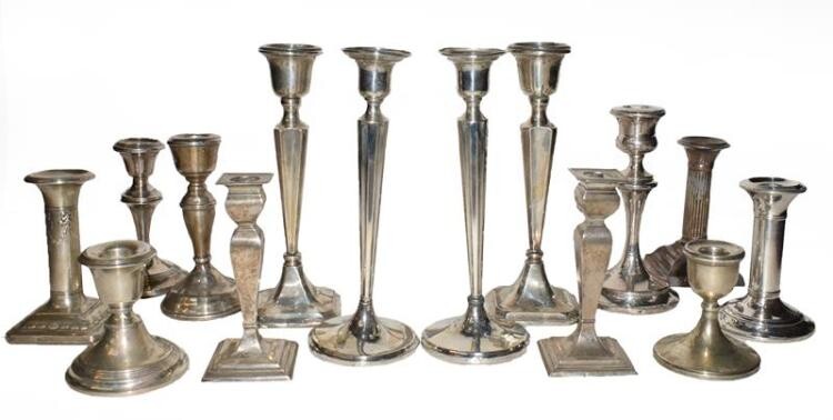 A collection of assorted silver candlesticks, (a.f), filled (one tray)...