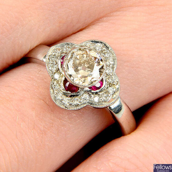 A diamond and ruby accent quatrefoil ring.