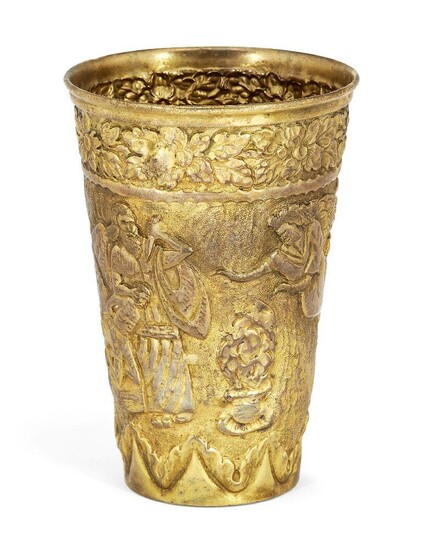 A gilt metal cup, apparently unmarked, chased with scenes depicting the sacrifice of Isaac, 12 cm high, approx. weight 4.2oz