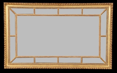 A giltwood marginal wall mirror