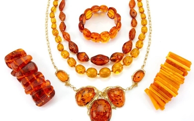 A group of miscellaneous amber and ambroid jewellery, including: a graduated heat treated amber necklace, three expanding bracelets and various other necklaces brooches and rings and pendants (a lot)