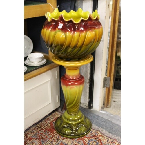 A large Bretby Pottery jardiniere and stand.