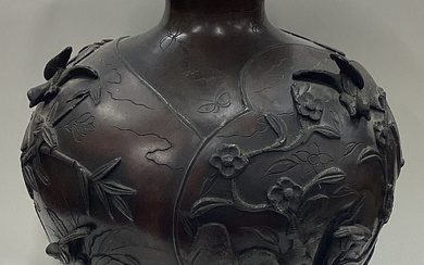 A large Chinese bronze vase with floral decoration.