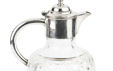 A late Victorian silver mounted cut glass claret jug, with...