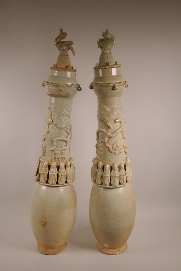 A pair of Chinese celadon crackle glazed pottery jars and co...