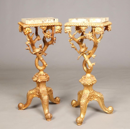 A pair of George II style marble top giltwood torchere stand...