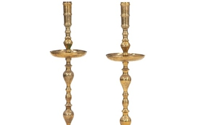 NOT SOLD. A pair of Persian brass candlesticks. 20th century. H. 100 cm. (2) –...