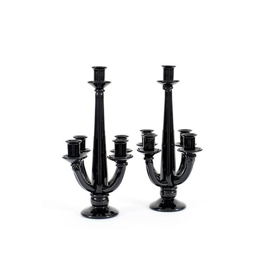 A pair of black glass five light candelabra