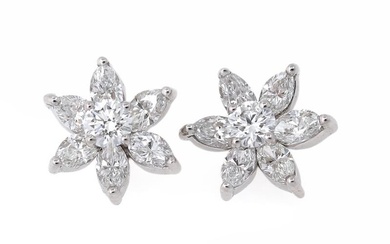 A pair of diamond ear studs each set with a brilliant-cut diamond...