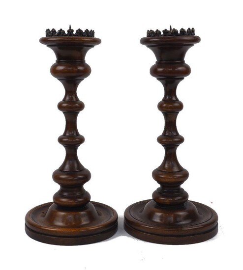 A pair of large turned beech candlesticks, late 20th century, each with bronze pricket and waisted knopped stem, 44cm high (2)