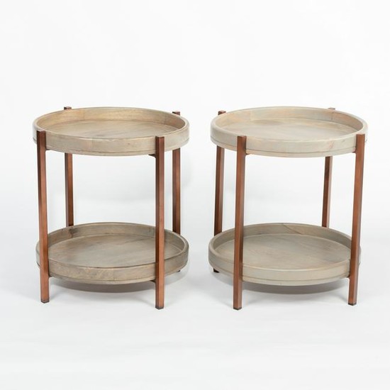 A pair of modern circular two-tier tables, with dished
