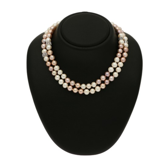 A pearl necklace set with numerous cultured freshwater pearls, four beads set with numerous brilliant-cut black diamonds, mounted in 18k white gold. L. 90 cm