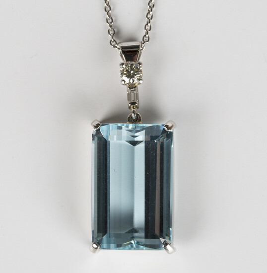 A platinum, aquamarine and diamond pendant, claw set with a rectangular cut aquamarine and a diamond
