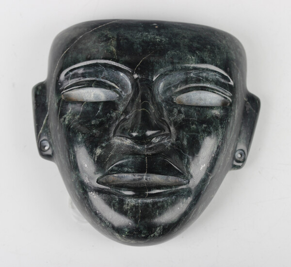 A pre-Columbian Teotihuacan style carved dark green and black hardstone mask, probably 250-700 AD, w