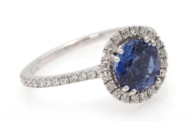 A sapphire and diamond ring set with a sapphire weighing app. 1.60 ct. encircled by numerous diamonds, mounted in 18k white gold. Size 54. – Bruun Rasmussen Auctioneers of Fine Art